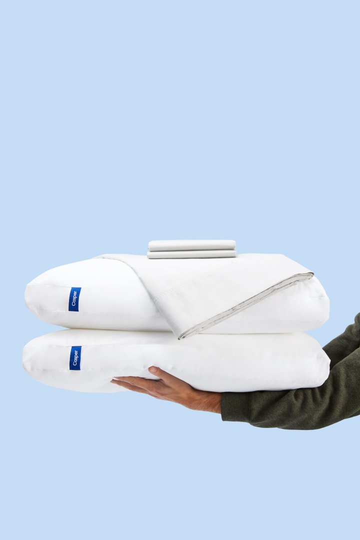 White pillows and a folded sheet with a "35% off" badge on a white background. The headline "Bundles" appears above the image.